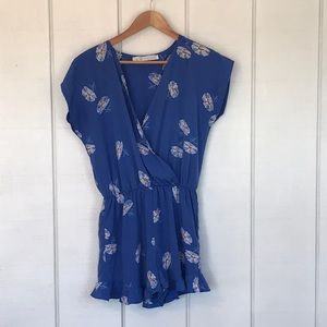 Ruffled blue romper with flowers